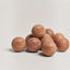 Maison Pupa cedar wood pet toy balls with engraved branding, featuring a natural finish and minimalist design.