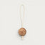 Maison Pupa hanging pet toy featuring a natural cedar wood ball with a cream rope loop and tassel detail.